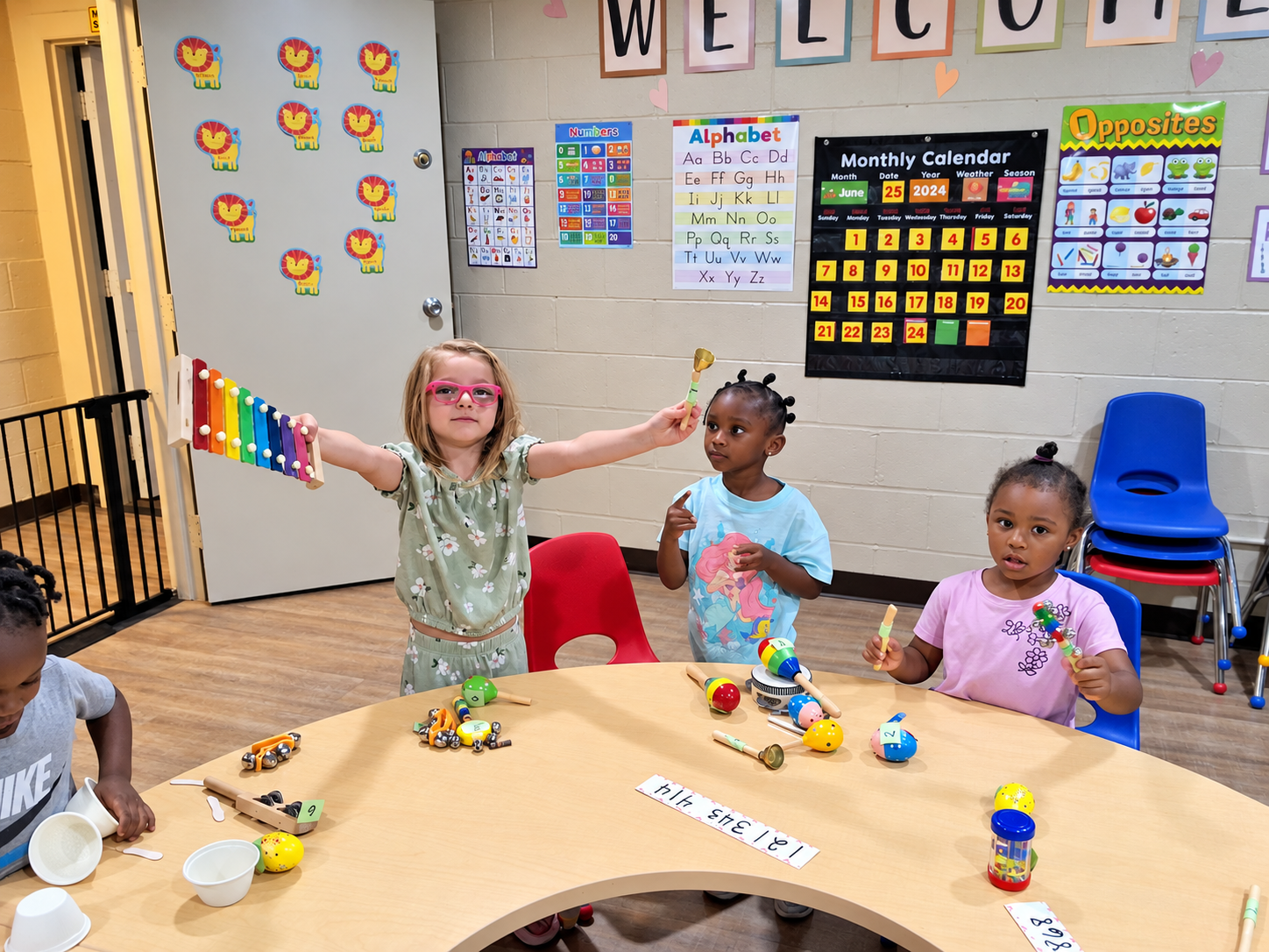 Children exploring colorful musical instruments together in the classroom