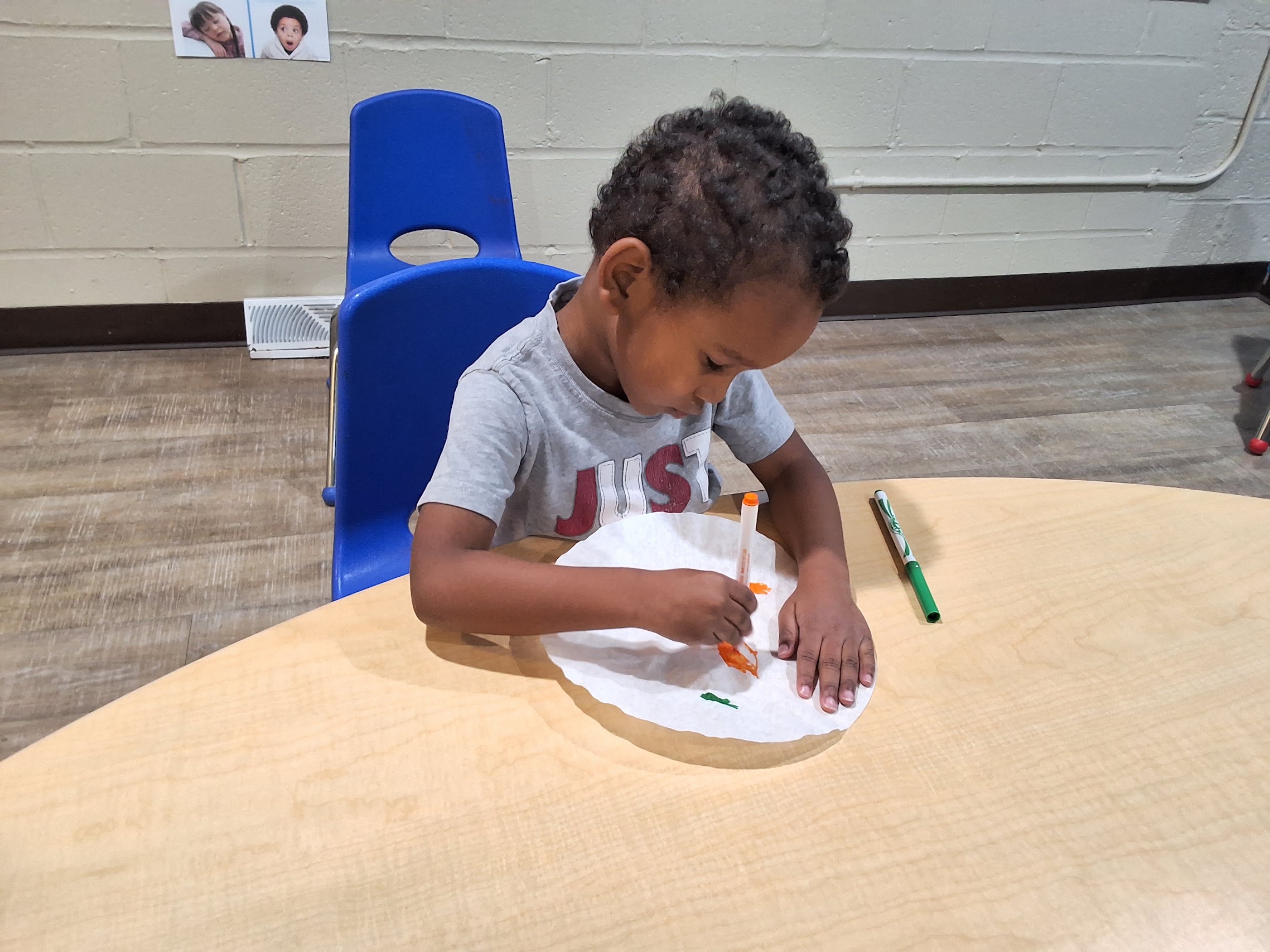 A child concentrating on a hands-on classroom activity